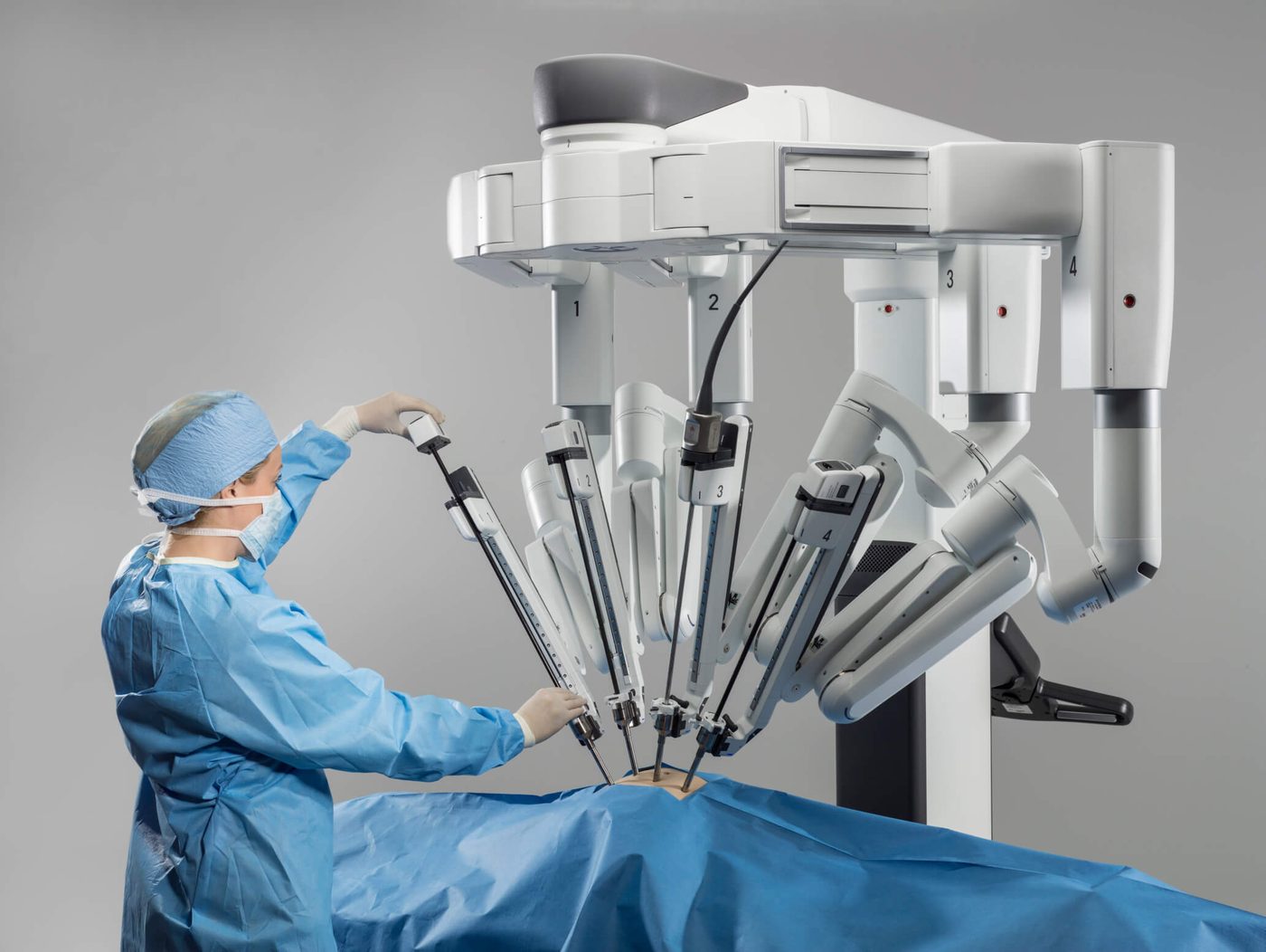 Surgeon operating a da Vinci robotic surgical system in theatre